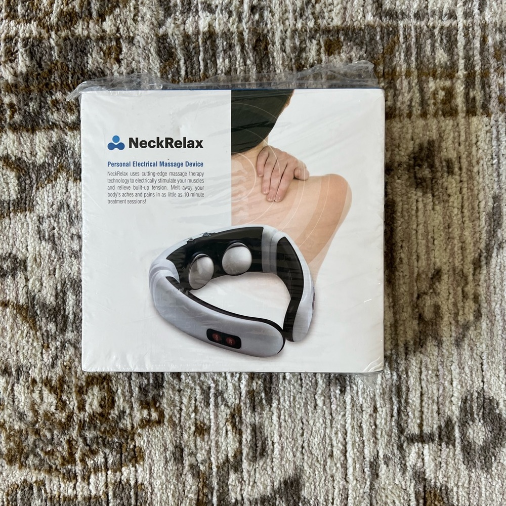Personal electric neck massager. New in box.